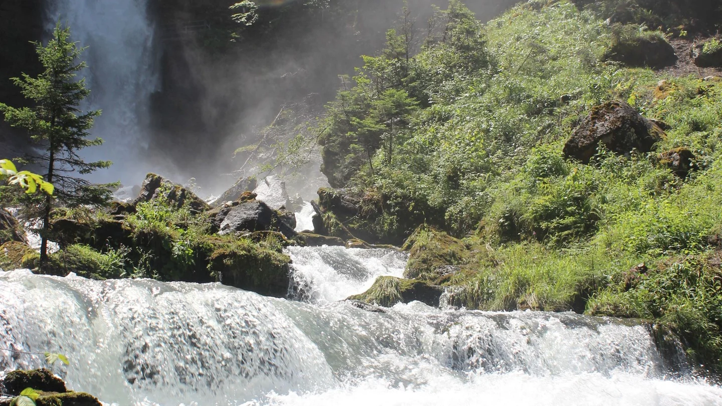 Giessbach Falls cascading through greenery